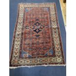 A Caucasian Hamadan red ground rug, 220 x 136cm