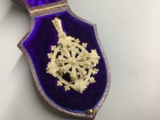 A 19th century seed pearl pendant, 55 mm, in fitted box.