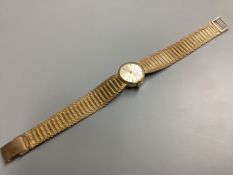 A lady's modern 9ct gold Avia manual wind wrist watch, on integral 9ct gold bracelet, overall 17.