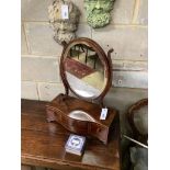 A George III mahogany serpentine box base toilet mirror, width 44cm, depth 20cm, height 58cm