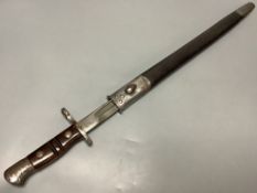 A WWII bayonet, blade marked ‘1913 3 17 REMINGTON’