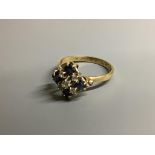 An 18ct, sapphire and diamond cluster ring, size N, gross 3.1 g.
