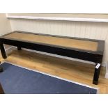 A Chinese lacquer caned bench, length 208cm, width 55cm, height 54cm