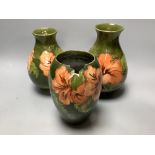 Two Moorcroft Hibiscus vases and another, similar, tallest 21cm