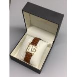 A gentleman’s gilt sterling Rotary quartz wrist watch, on a leather strap with rotary box.