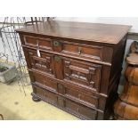 An 18th century oak geometric moulded two part chest, width 105cm, depth 58cm, height 100cm