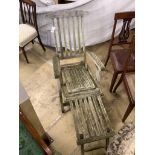 A weathered teak folding garden steamer chair