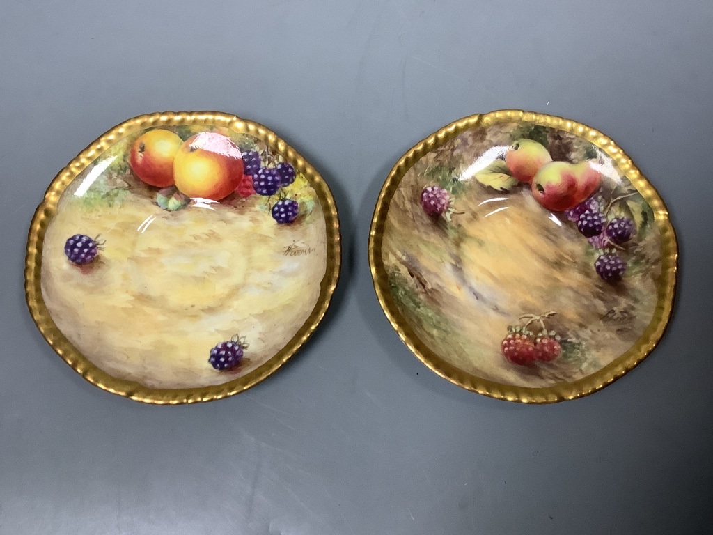 A pair of Royal Worcester fruit painted coffee cups and saucers, signed Freeman, (one saucer - Image 2 of 3