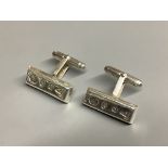 A modern pair of silver cufflinks by Harrods, length 23 mm, 15.7 g, with Harrods box.