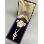 A 19th century seed pearl encrusted drop brooch in fitted box, 13.9 cm.