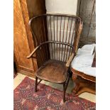 An early 20th century ash and beech Windsor comb back armchair, width 65cm, depth 60cm, height