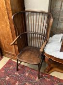 An early 20th century ash and beech Windsor comb back armchair, width 65cm, depth 60cm, height