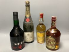 A bottle of Moet & Chandon, A bottle of Chivas Regal and two other bottles
