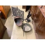 An ironwork fireside companion set, a Victorian copper coal scuttle and a brass jam pan (3)
