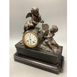 An early 20th century French spelter and slate cherub mantel clock, height 34cm