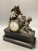 An early 20th century French spelter and slate cherub mantel clock, height 34cm