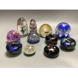 Eleven glass paperweights
