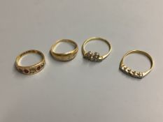 Three assorted 18ct and diamond set dress rings, gross 7.2 grams,and a 15ct and gem set ring,