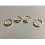 Three assorted 18ct and diamond set dress rings, gross 7.2 grams,and a 15ct and gem set ring,