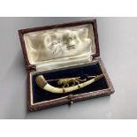 An Indian 14ct and bone mounted 'tiger' set curved brooch, by Hamilton & Co, in original box,7cm,