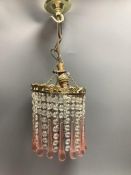 A ceiling pendant with clear and pink glass drops and a set of four French ormolu curtain tiebacks