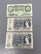 Two £5 notes and one £1 note