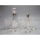 A silver collared cut glass decanter and a glass scent bottle with 800 standard silver stopper,