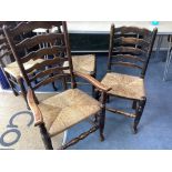 A set of twelve ash rush seat ladder back dining chairs (two with arms)
