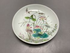 A Chinese famille rose 'birds and lotus' saucer dish, diameter 13.5cm