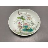 A Chinese famille rose 'birds and lotus' saucer dish, diameter 13.5cm