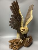 A carved wood eagle, height 61cm