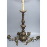 A pair of rococo style twin light wall sconces, and an Italian period style giltwood table lamp,