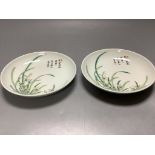 A pair of Chinese enamelled porcelain saucer dishes, diameter 14cm