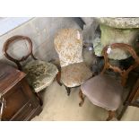 A Victorian ebonised and gilt upholstered nursing chair and pair of balloon back chairs