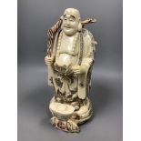 A Chinese engraved and stained bone figure of Budai, height 29cm