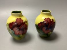 A pair of Moorcroft yelow ground Hibiscus vases, height 9cm