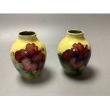 A pair of Moorcroft yelow ground Hibiscus vases, height 9cm