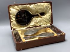 A cased George V silver and tortoiseshell mounted six piece mirror and brush set, maker Harper and