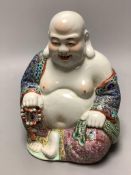 A Chinese famille rose figure of Budai, height 19cm