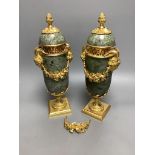 A modern pair of gilt metal and marble urns32cm