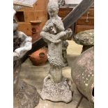 A reconstituted stone seated Pan garden ornament, height 88cm