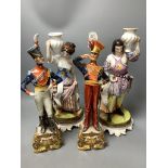 A pair of Italian porcelain figures of soldiers and a pair of Continental figural candlesticks