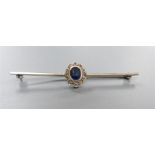 An early 20th century white metal , sapphire and diamond cluster set bar brooch, 58mm, gross 3.3