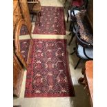 A pair of Caucasian red ground rugs, 154 x 97cm