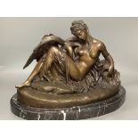 A cold cast resin bronze of Leda and the swan, on marble base, length 48cm
