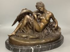 A cold cast resin bronze of Leda and the swan, on marble base, length 48cm