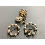 Three assorted modern 9ct gold brooches, one set with emerald, diamond and cultured pearl and two