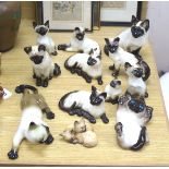 Twelve Beswick cats including Siamese