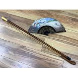 Two walking sticks, one with marine ivory handle and a painted fan