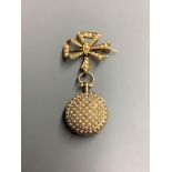 A lady's early 20th century yellow metal and seed pearl set fob watch, on a 18ct and seed pearl